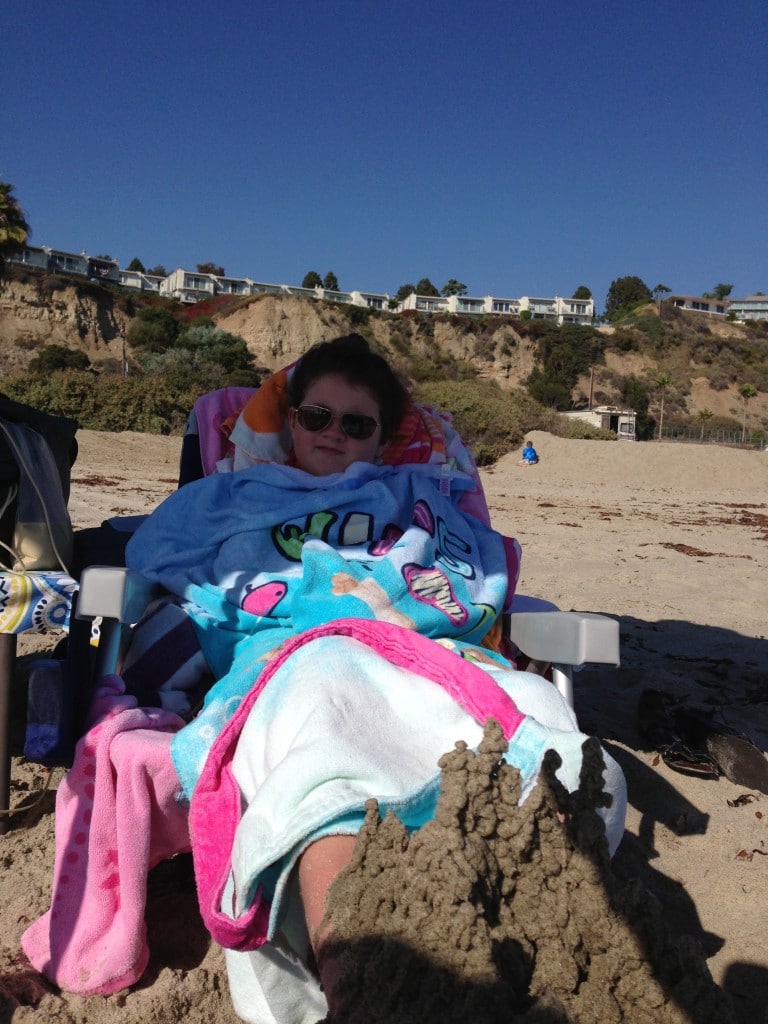 Lily-sitting-on-beach